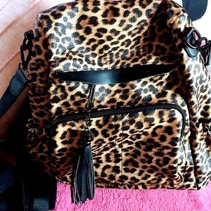 Backpack/ handbag leopard collection! With beautiful matching make up Bag and